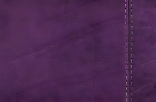 Close-up of purple bonded leather with visible stitching detail