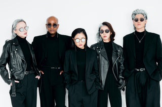 Stylish group in black outfits showcasing leather jacket etiquettes