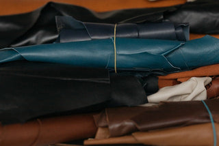 Rolled buffalo leather hides in various colors and textures.
