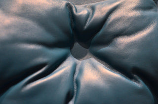 Close-up of wrinkled leather surface showing creases and texture
