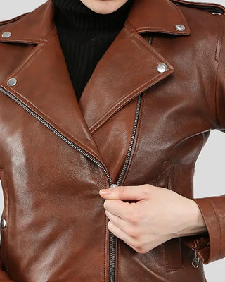 Close-up of brown leather jacket with zipper detail